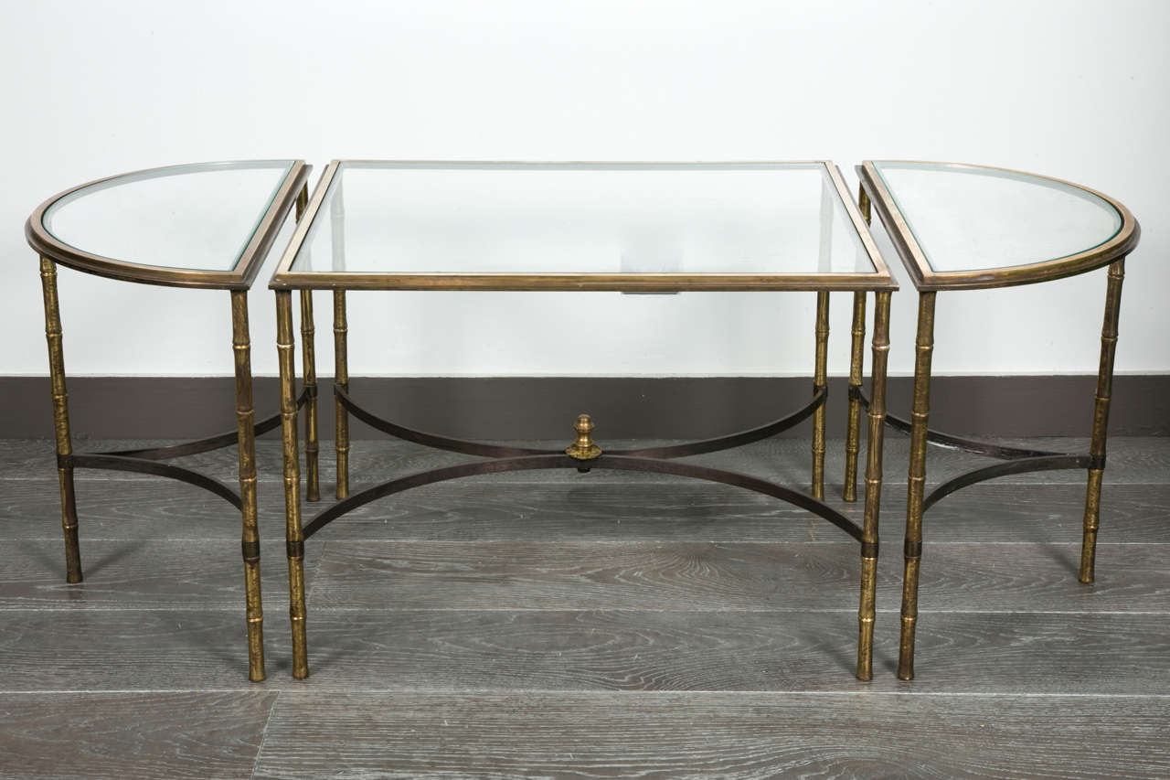 Cocktail table in 3 parts with faux bamboo  style and top glass( some wears)
Bronze and brass with original patina ( gold and black)
By Maison Baguès