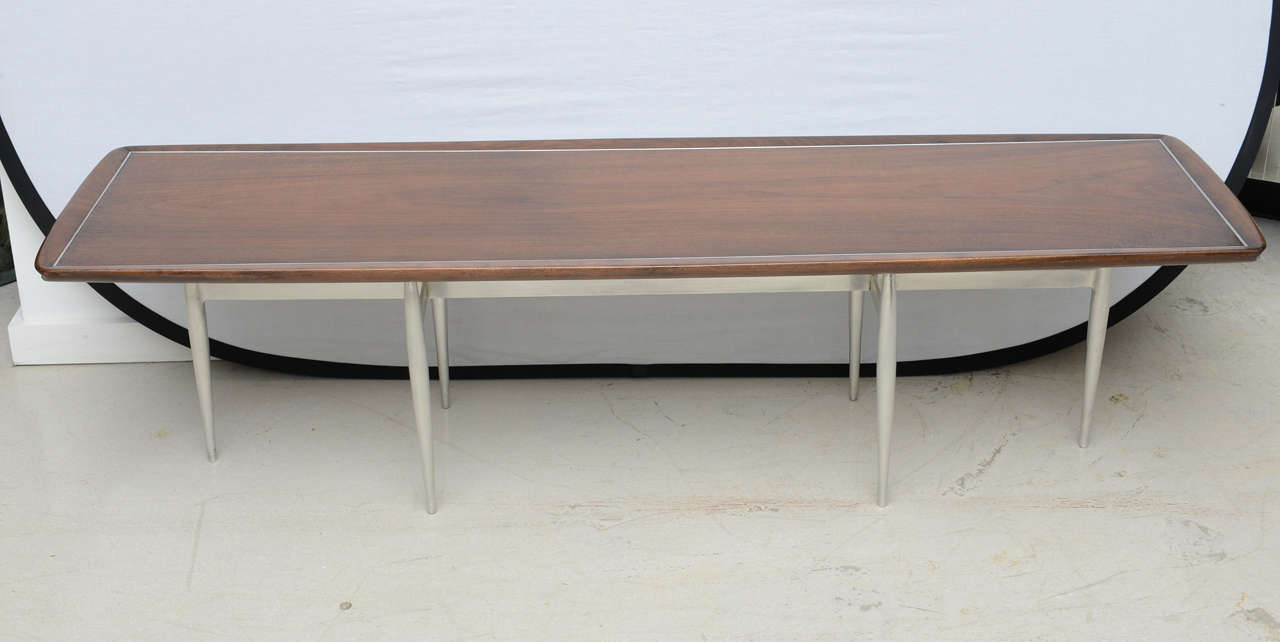Long aluminum and walnut coffee table designed by American designer Donald Deskey for Charak 1957.