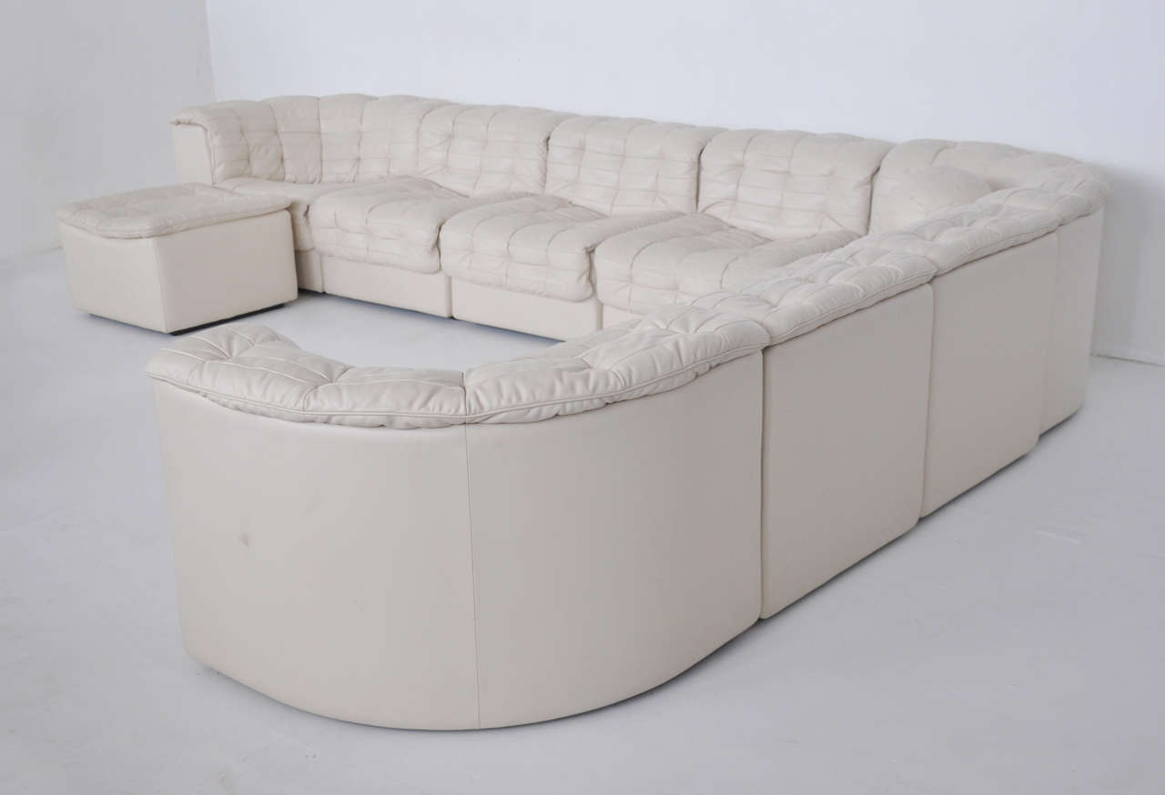 De Sede DS11 white leather sectional sofa. Nine-piece sectional with leather ball pillow. Made in Switzerland, circa 1970s.

Corner and end pieces measure 30 wide, middle pieces 25 wide.