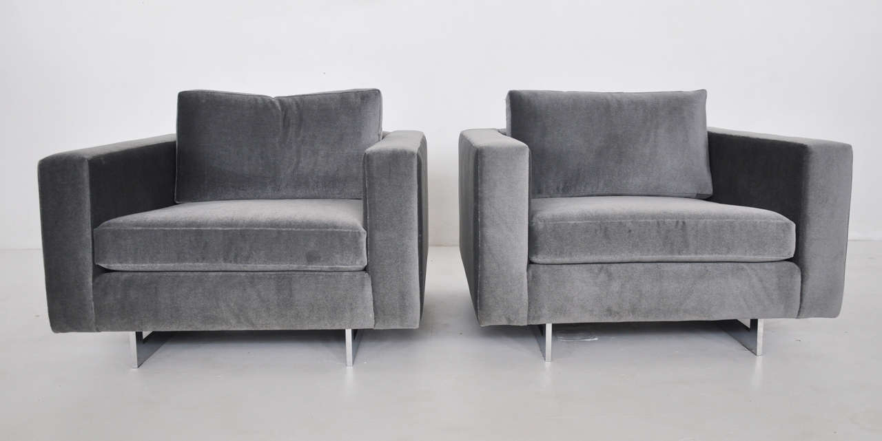 Pair of lounge chairs by Jens Risom. Newly upholstered in charcoal mohair. Polished chrome sled bases.