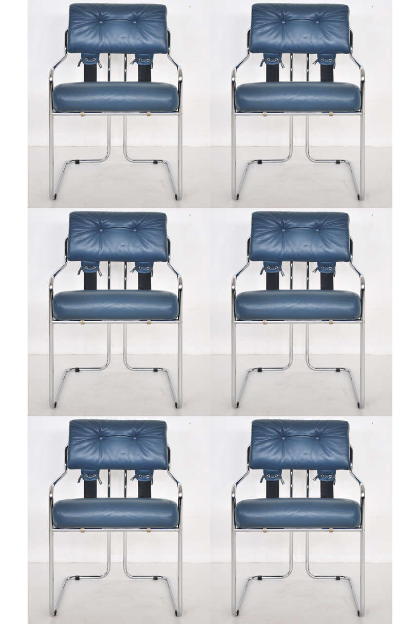 A set of Tucroma dining chairs designed by Guido Faleschini in 1972 and produced in Italy by Mariani for Leon Rosen's Pace Collection. Simple tubular chrome base with soft blue leather upholstery.
