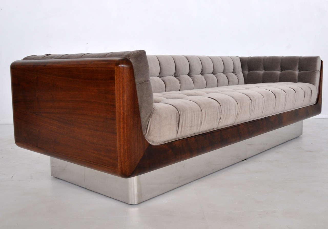 Walnut case sofa on stainless steel frame. Newly upholstered, fully restored.