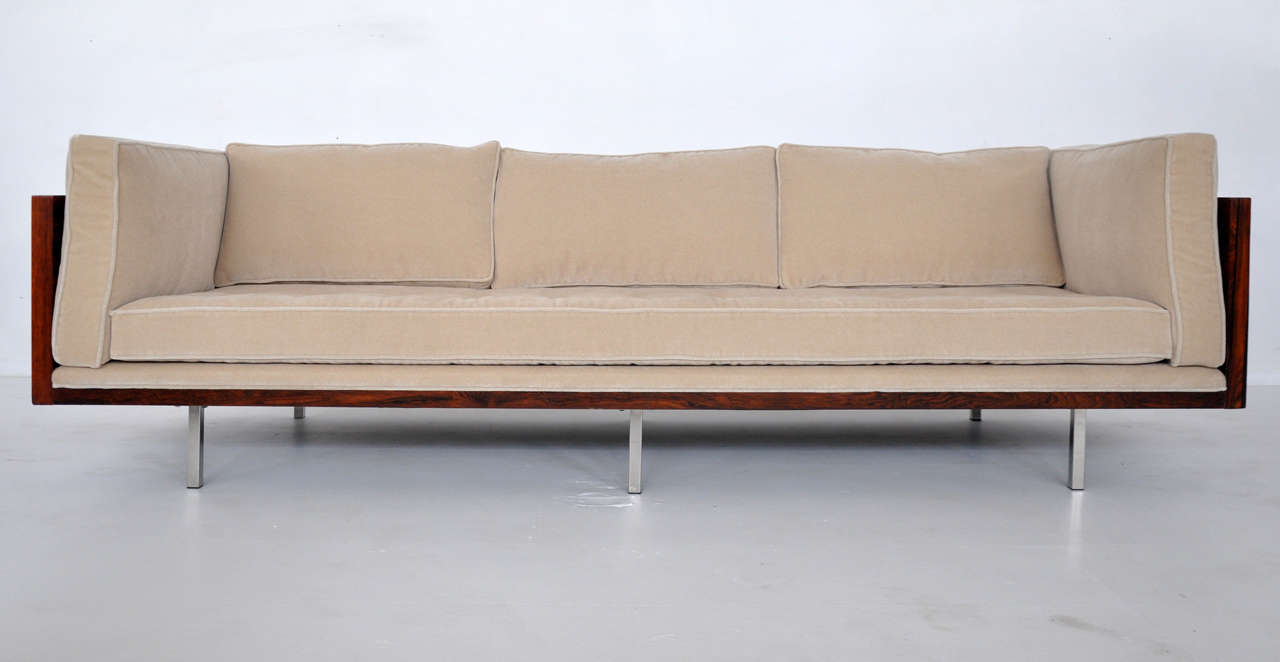 Rosewood case sofa by Milo Baughman. Fully restored and refinished. Reupholstered in plush cream mohair.