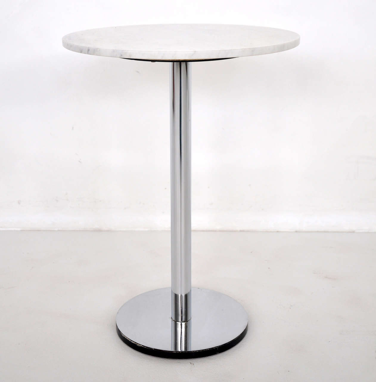 Marble side table on chrome pedestal by Hugh Acton.