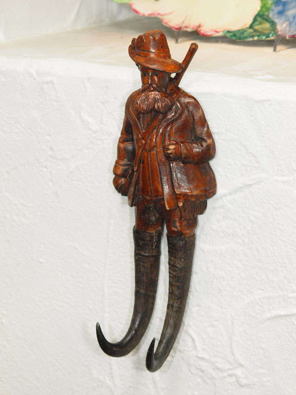 Traditional Black Forest carved whip/crop hook of a huntsmen in traditional garb. Antler hooks. Germany, 1900.