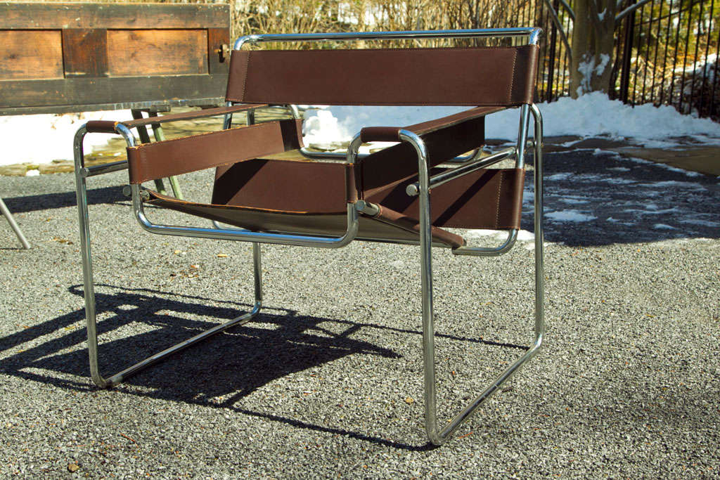 Tubular Chrome Frame with Straps of Beautiful Brown Leather.  Designed by Marcel Breuer for Knoll.