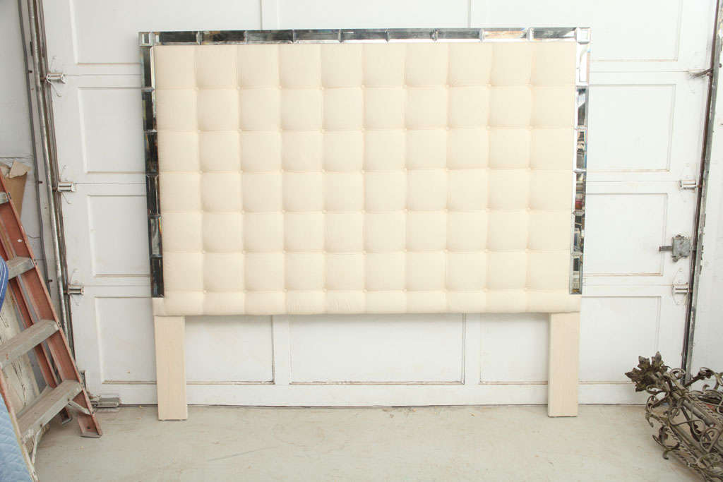 Clean, Contemporary yet Timeless headboard with tufting and elegant smoked mirror trim.  King and Queen