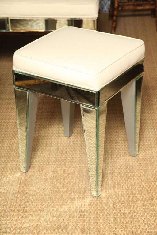 Beveled mirror upholstered stool with unique legs.
Perfect as a pair of individually, for use as extra seating or a vanity or just fill a corner. We can custom sizes, c.o.m.