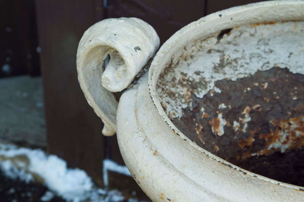 Pair of Painted Cast Iron Regency Urns with Volute Handles In Good Condition For Sale In Mt. Kisco, NY