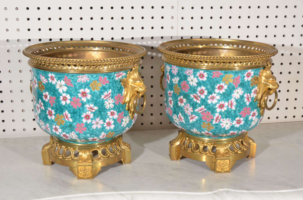 porcelain planters with cast bronze gold plated bases, rim and mounts