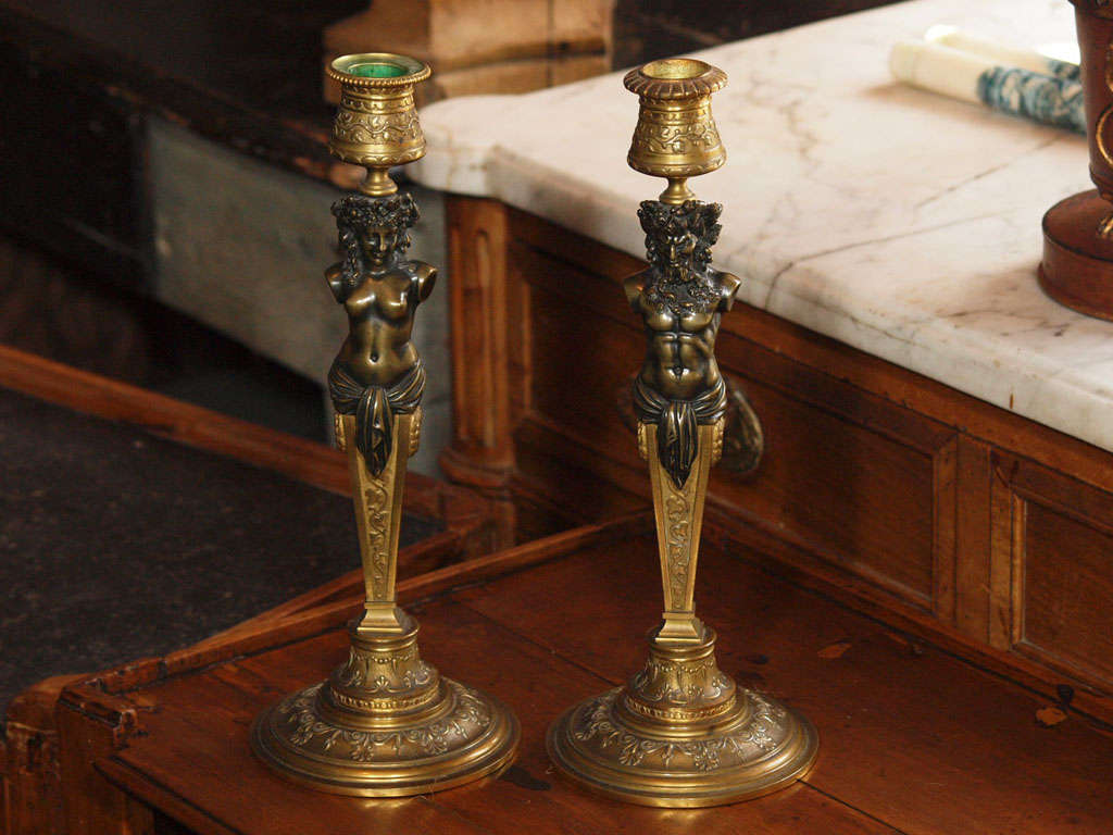 Pair of bronze figural candlesticks