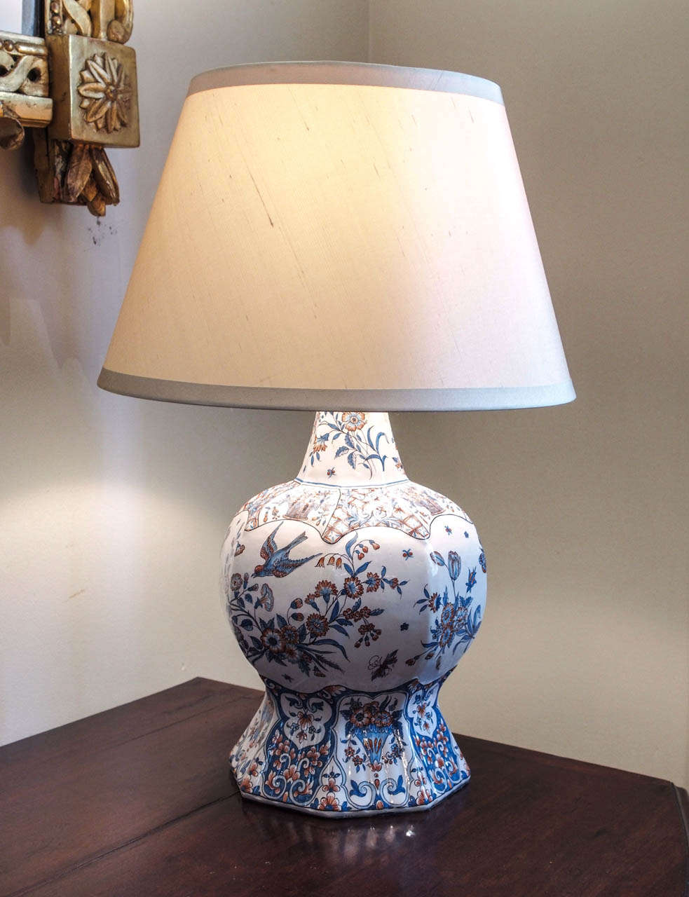 A 19c. faience gourd shaped vase now mounted as a lamp.  Finely painted in blues and reds on a creamy white ground.