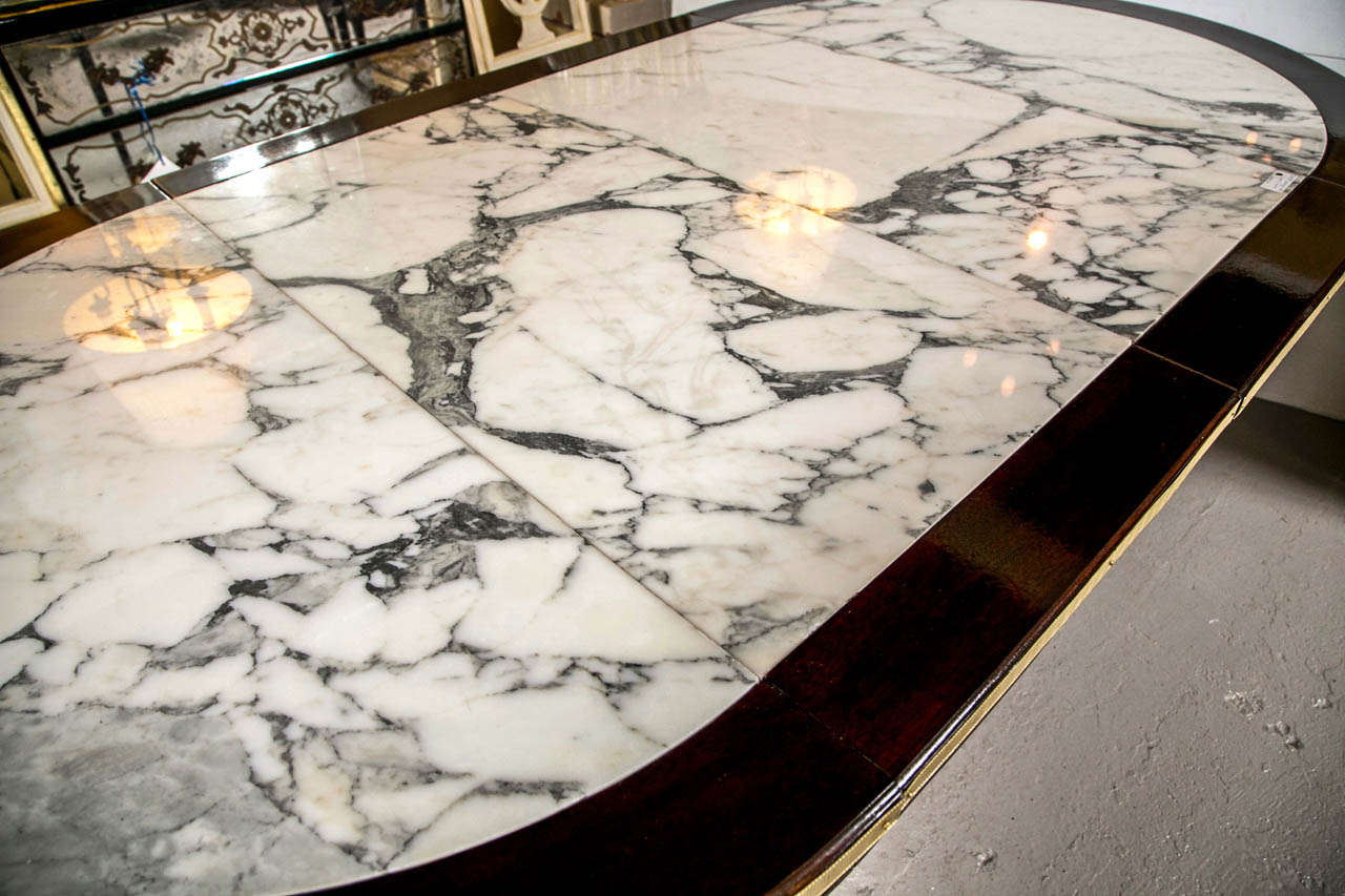 Louis XVI A Two Leaf Marble Top Dining Table by Maison Jansen