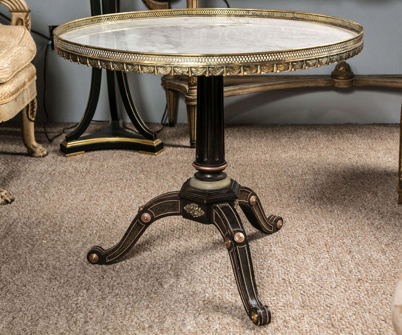 A very fine and rare Russian neoclassical style centre table by Jansen. This table with ebonized woods is finely casted in bronze mounts sitting on a tri-pod base having all-over bronze mounts leading to a central tapering support. The white and