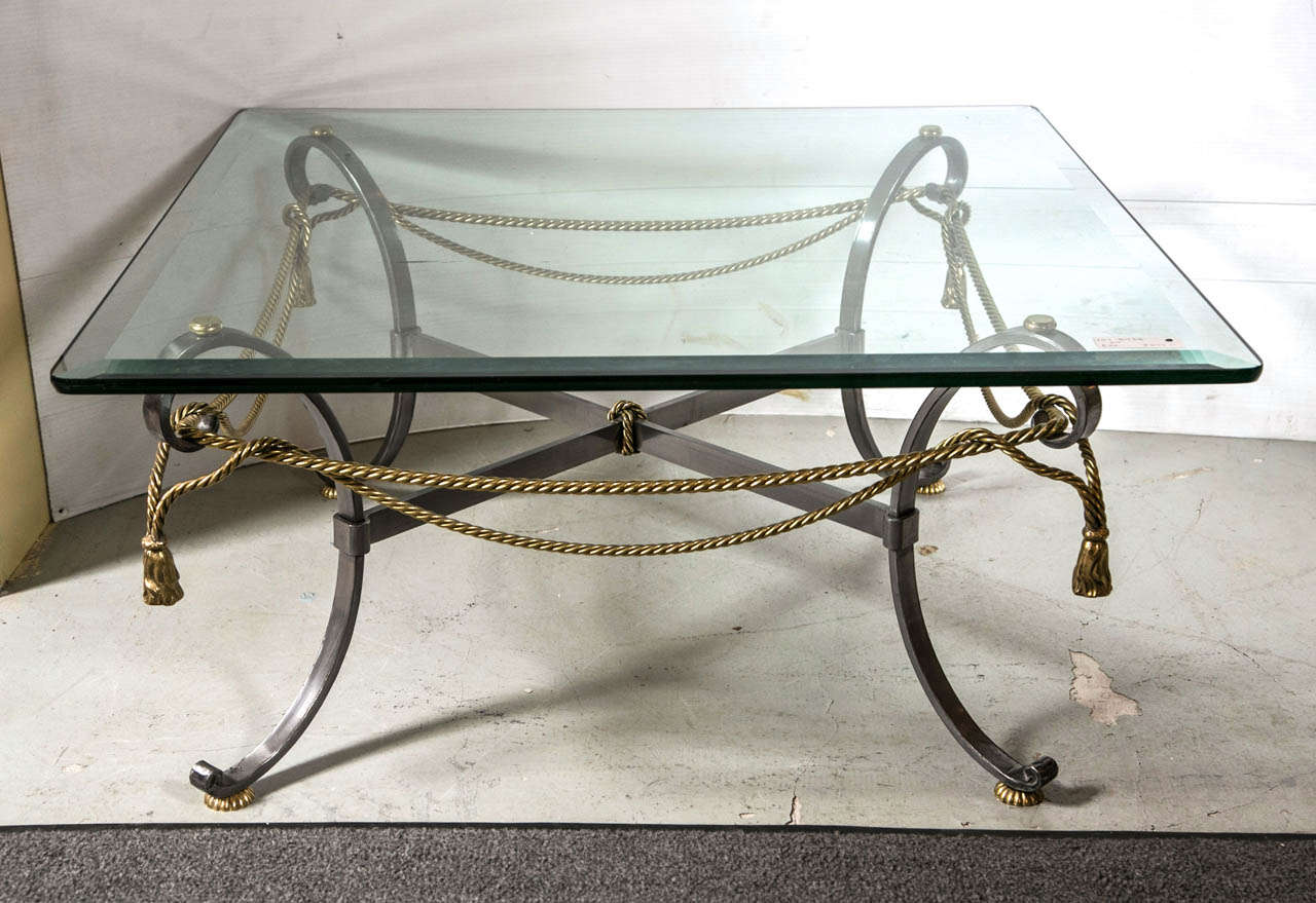 Tassel and ribbon form brass and steel coffee table.  36