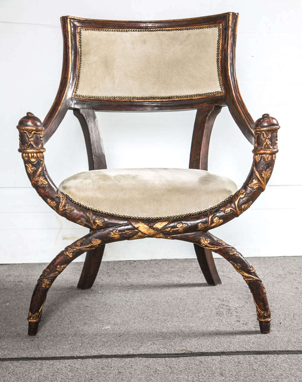 A pair of finely carved Cerule open armchairs. C shaped upper and lower fronts with curved arms and framed backs.