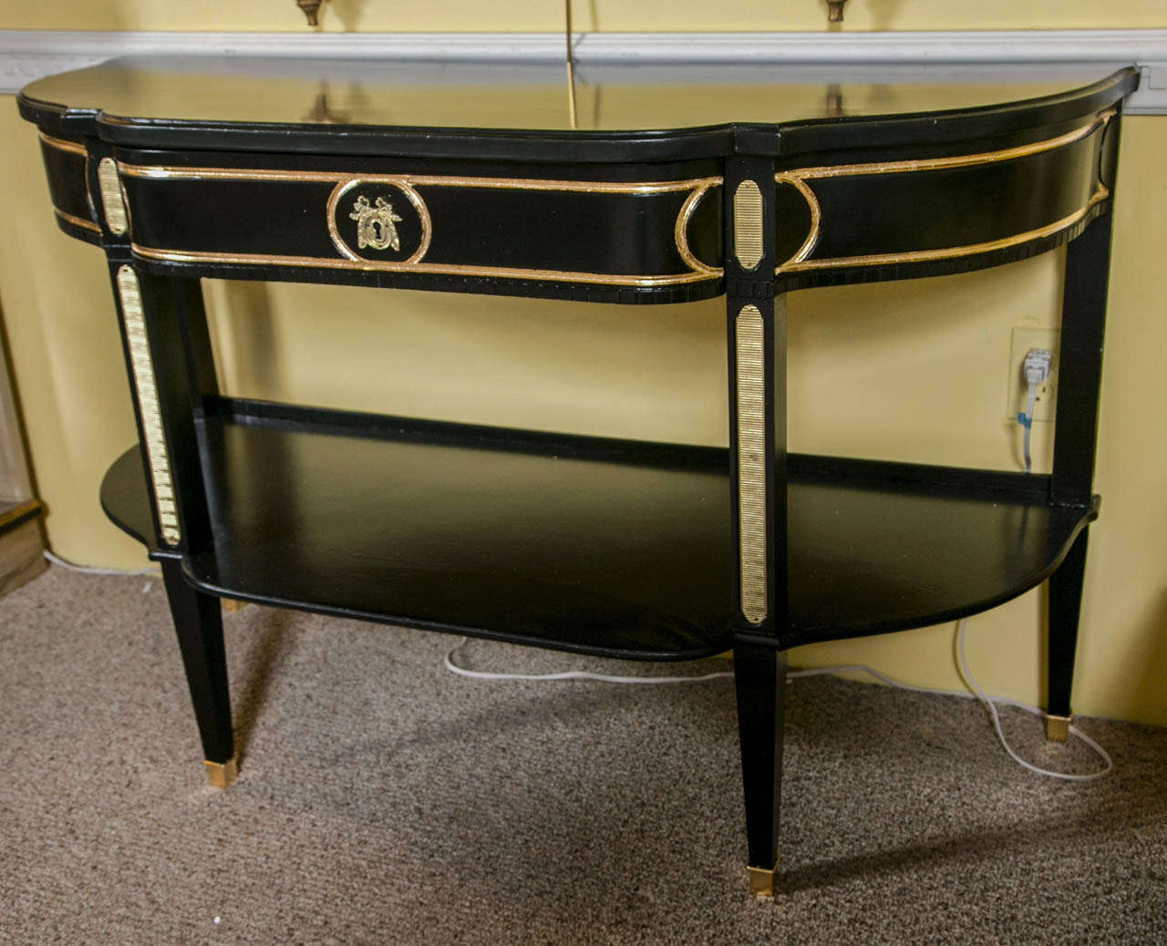 An early example of a very fine pair of Maison Jansen France Console Tables. Each stamped Made in France. The Louis XVI style tapering legs with bronze sabots having a lower connecting shelf and ribbed bronze fronts. Each center drawer flanked by
