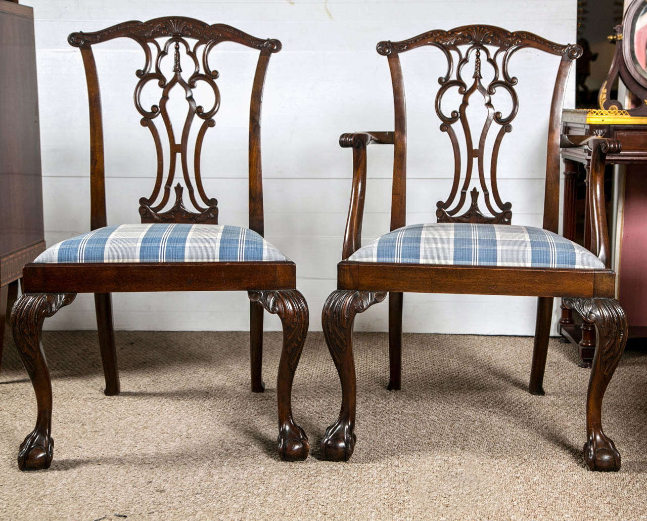 A set of eight ball and claw Chippendale dining chairs. Wonderfully carved ball and claw feet leading to a cabriole leg supporting an apron and slip seats. The pierced carved back splats of fine quality as is indicative of the period. Can buy as