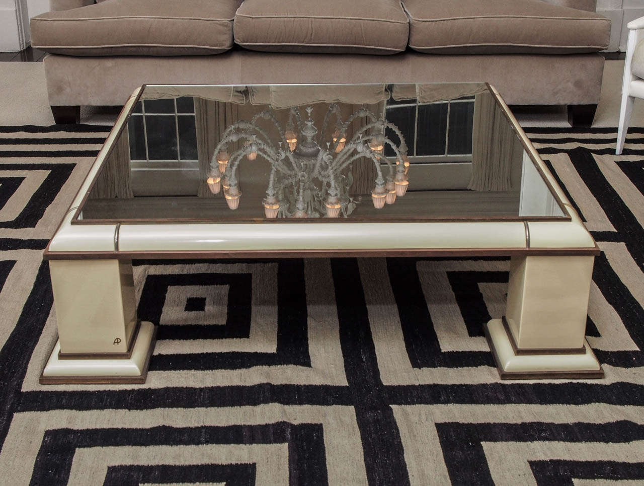 Large brass-trimmed ivory lacquer coffee table by Antonio Pavia with mirrored plateau; signed 