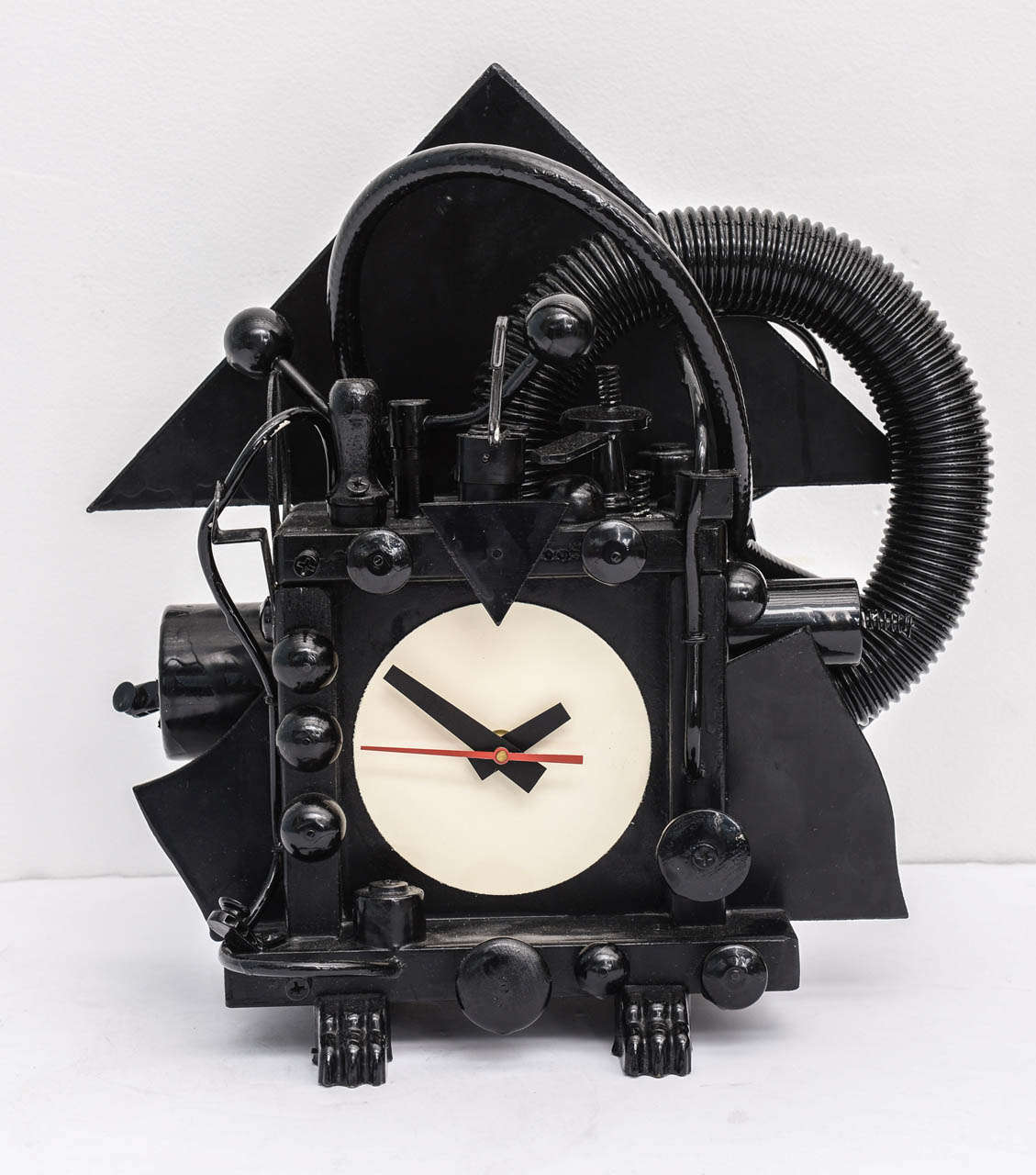 A vintage clock by Artist Richard Birkett, wood construction and other materials such as plastic and metal all finished in a glossy black make this art time piece a unique and It has Mr. Birkett style and artistry signature. It is signed and dated
