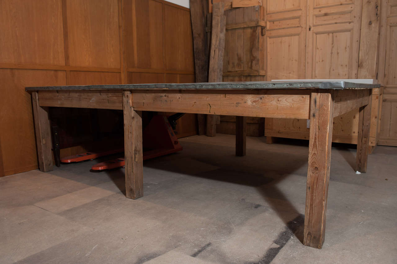 Early 20th century extraordinary work or dining table.
Carcass in pine with top wrapped in 3 sections beautifully patinated zinc.

Seats 10 easily 12 tight.

Belgium, circa 1910.