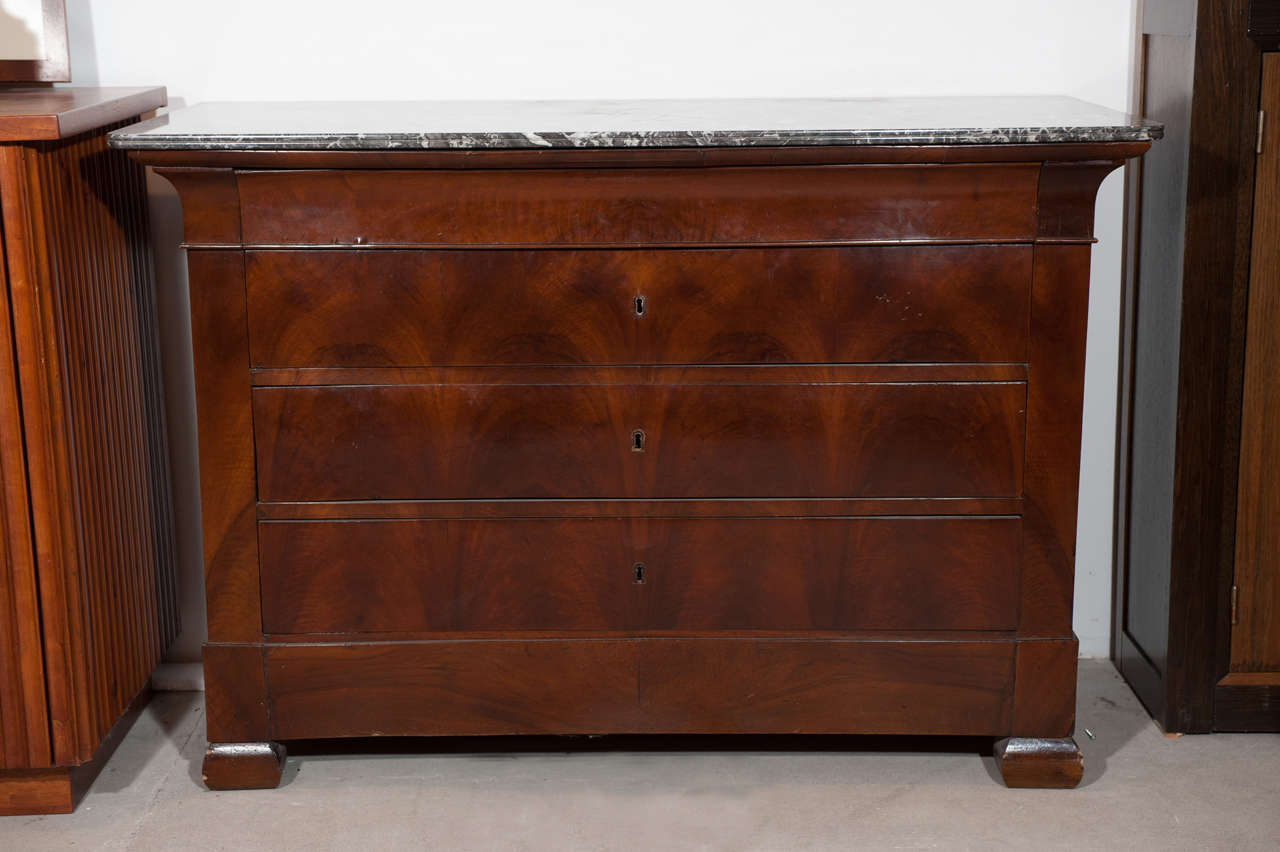 Early 19th century French mahogany Directoire commode with original marble top, circa 1830, France.