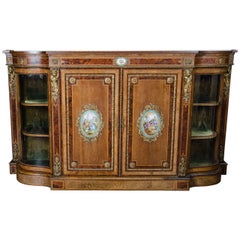 Used 19th Century bow fronted side cabinet with porcelain plaques. 77" wide (196cm)