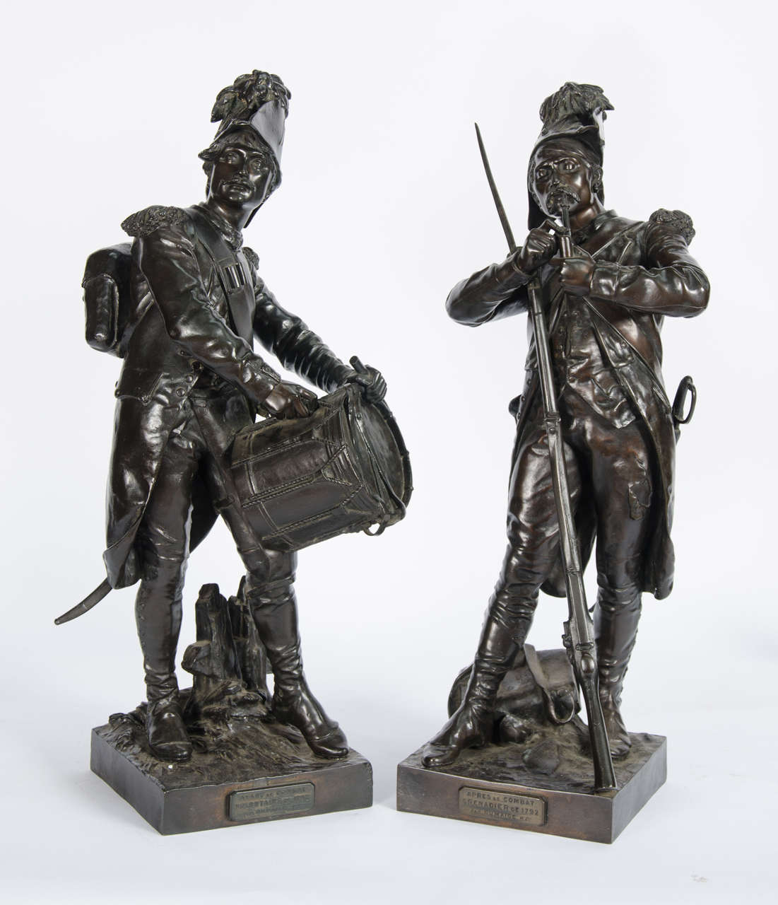 A very good quality pair of 19th century French bronze statues of a rifleman and drummer, signed E H Dumaige.