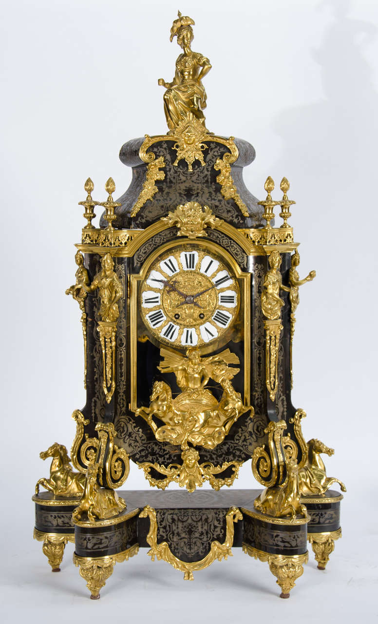 A very good quality French large gilded ormolu Boulle inlaid mantel clock. Having classical figures and scrolling mounts, enamel numerals, an eight day striking movement, raised on four rearing gilded ormolu horses.