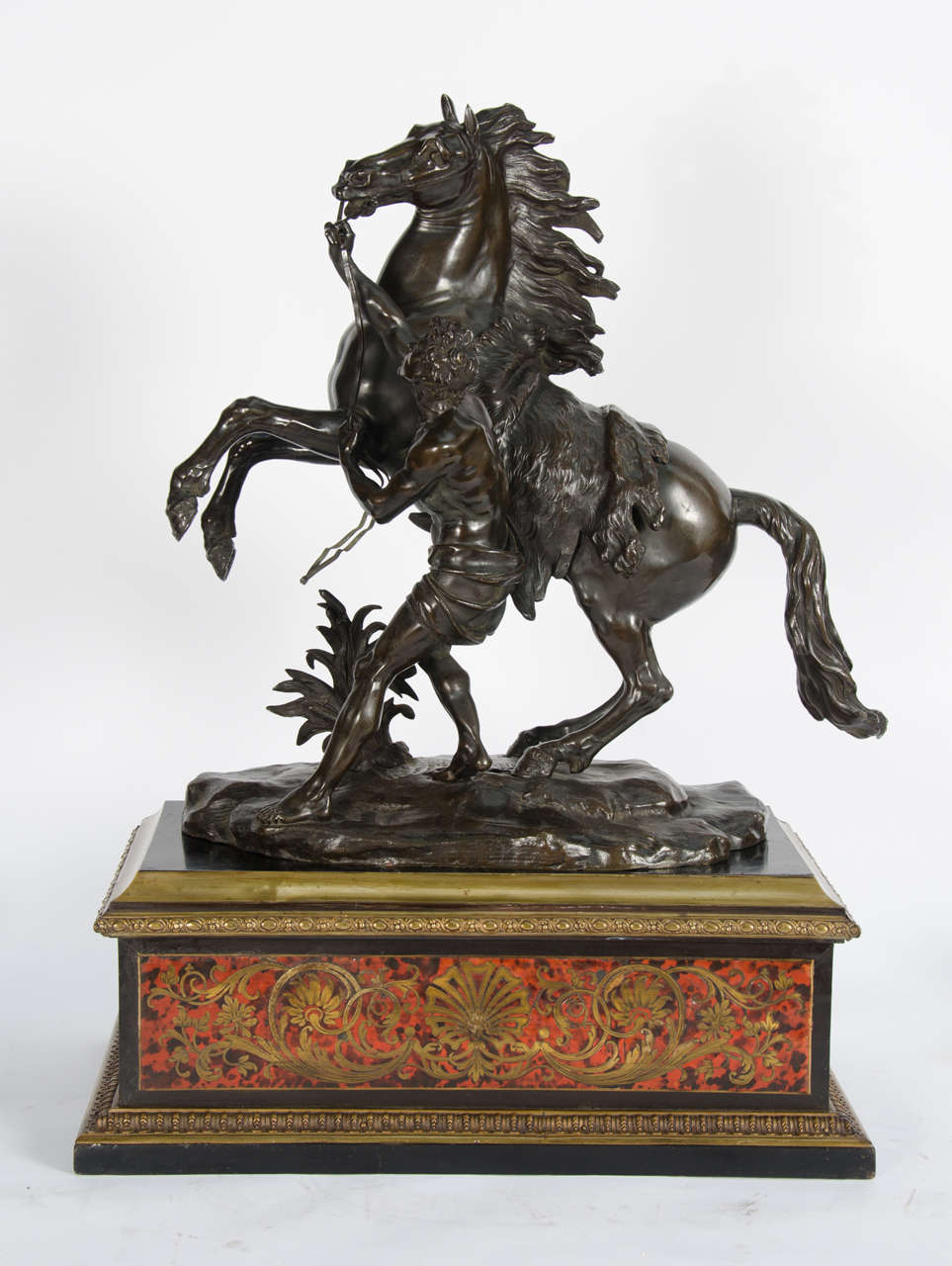A very impressive striking pair of French bronze Marly horses after Guillaume Coustou the elder 1677-1746. Mounted on ebonized, boulle inlaid pedestals.

