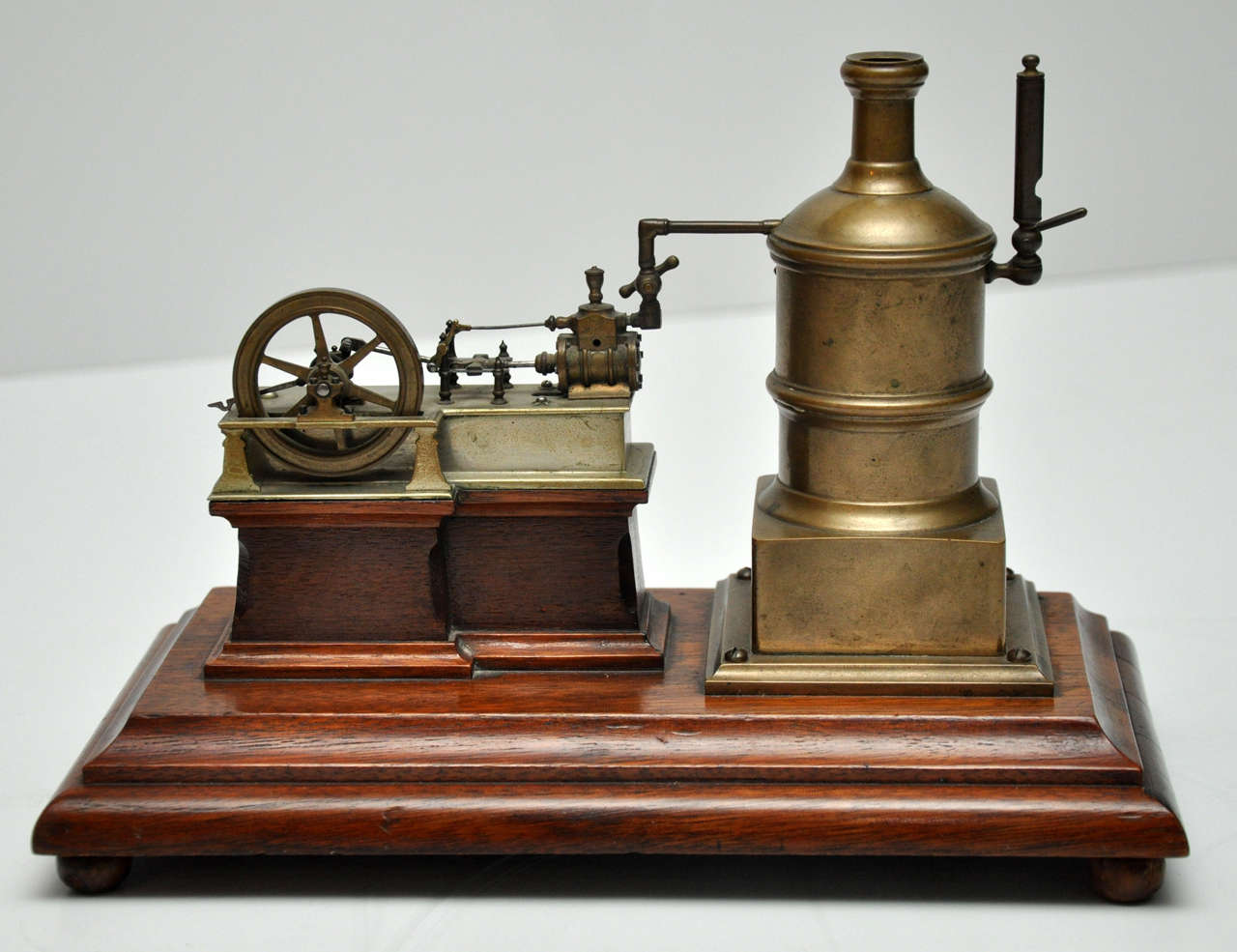 19th Century Brass Stationary Steam Engine on Walnut Base, France, 1870
Signed: ORESTES PAGAN 
Fabicante: Filadelfia  
With original Spirit Burner operates well.
Made for the Centennial International Exhibition of 1876, the first official