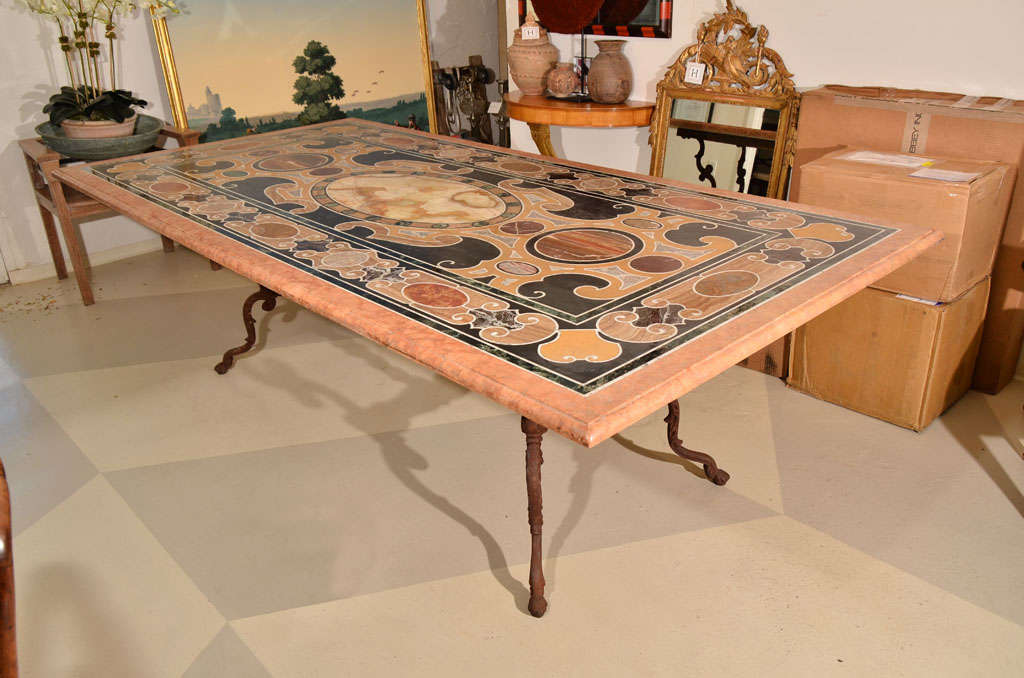 Beautiful 19th century Italian dining table, consisting of an inlaid polychrome Pietra Dura tabletop.  

Mounted on a later iron base. 

Weight approx 1,200 lbs