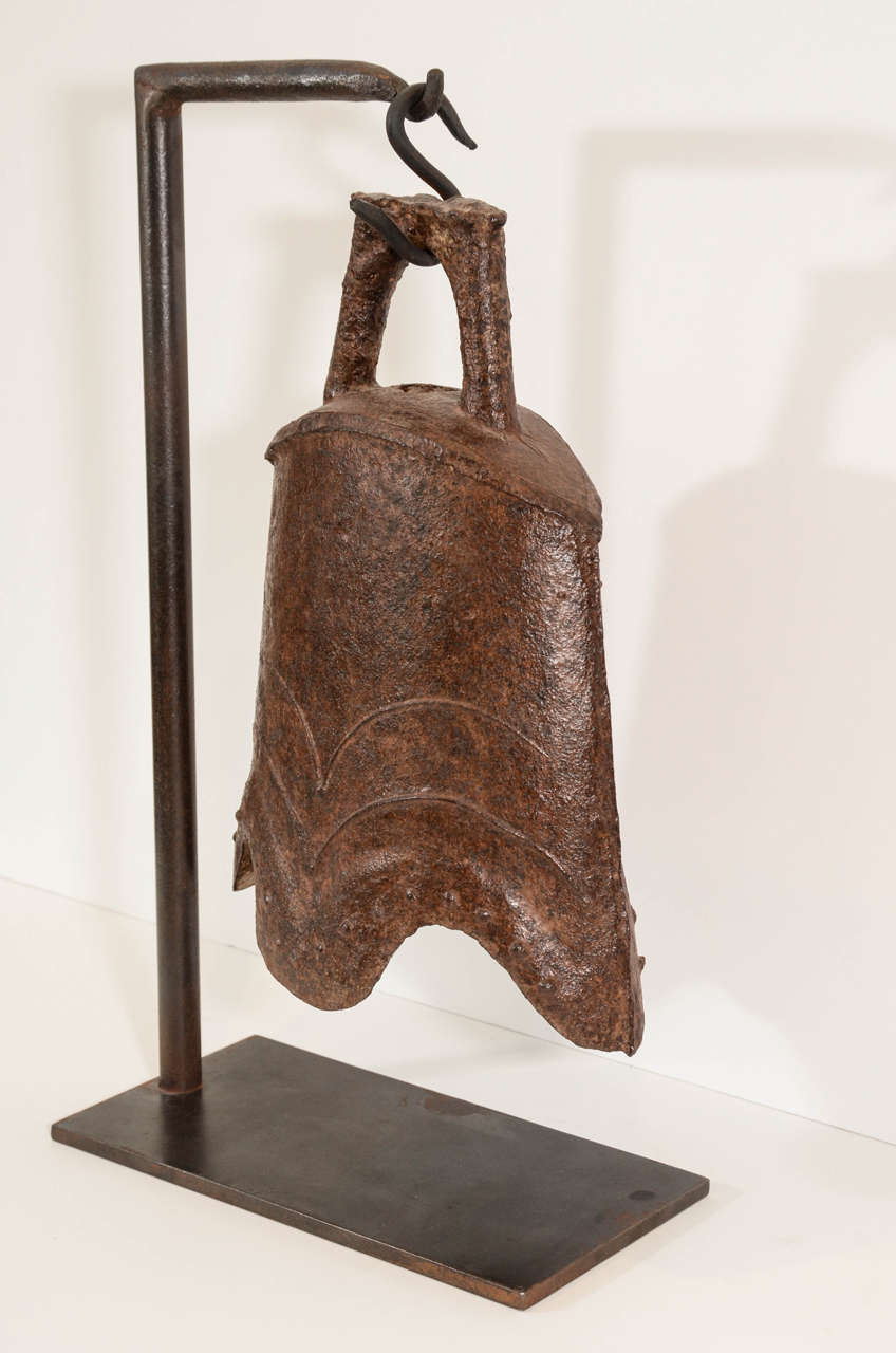 A decorated 18th Century cast iron bell from Shanxi Province with beautiful patina throughout and a lovely tone. Includes custom-made contemporary iron stand.
  