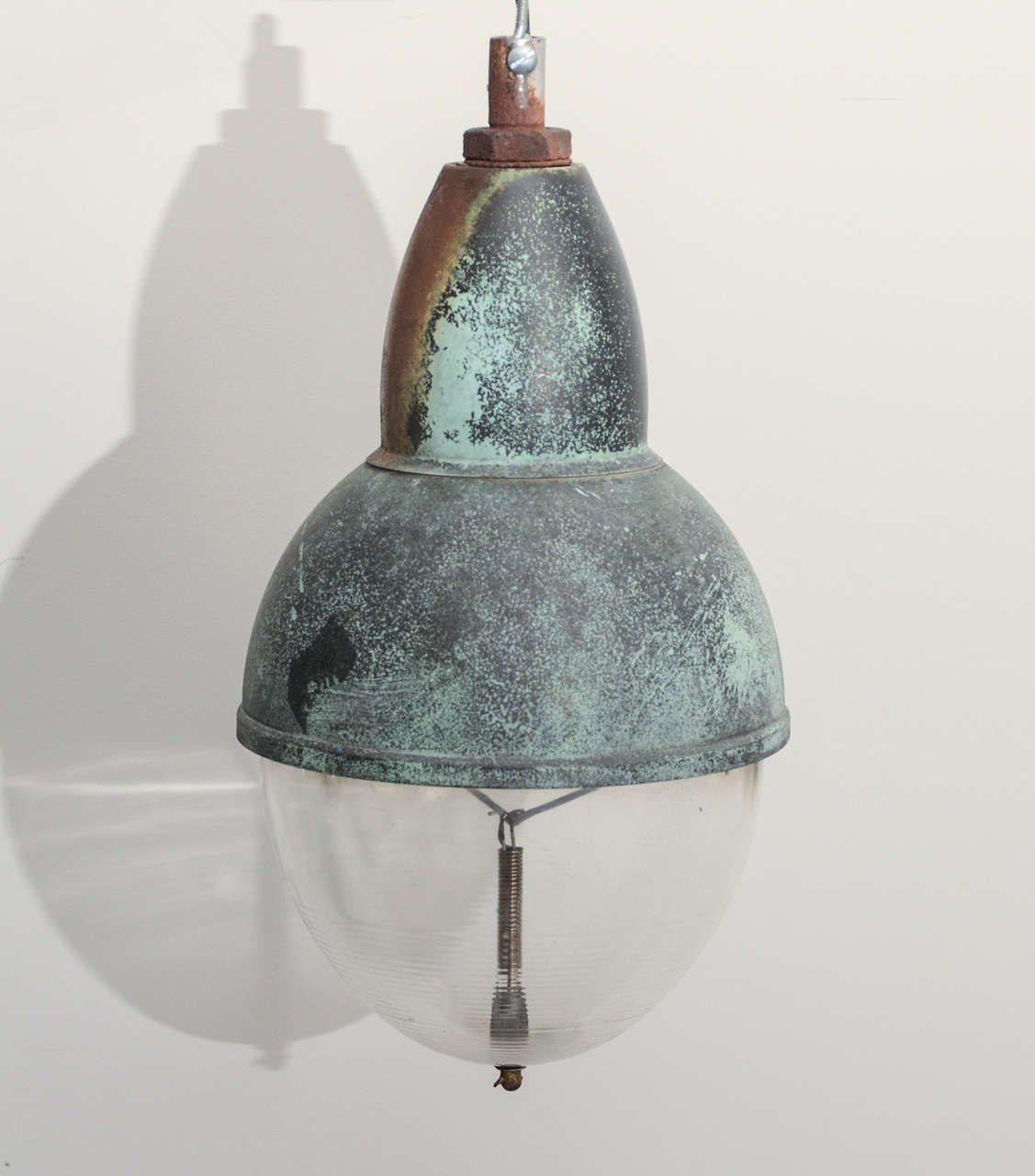 Vintage industrial copper pendant light with glass shade with a beautiful verdigris patina.