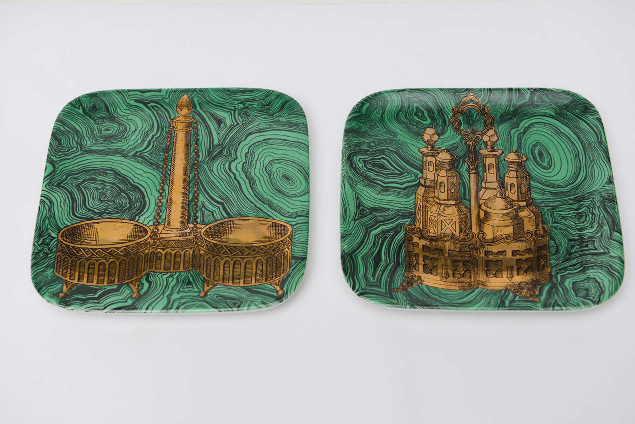 Originally mounted under glass in shadowbox frames, this pair of plates from Piero Fornasetti's 