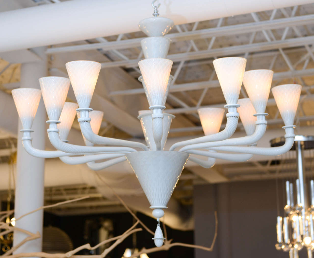 We were enchanted by the gorgeous, (and unusual) opaque, pale grey color and impressive scale of this mid-century Venetian chandelier (not to mention its almost-architectural simplicity). Twelve lights.