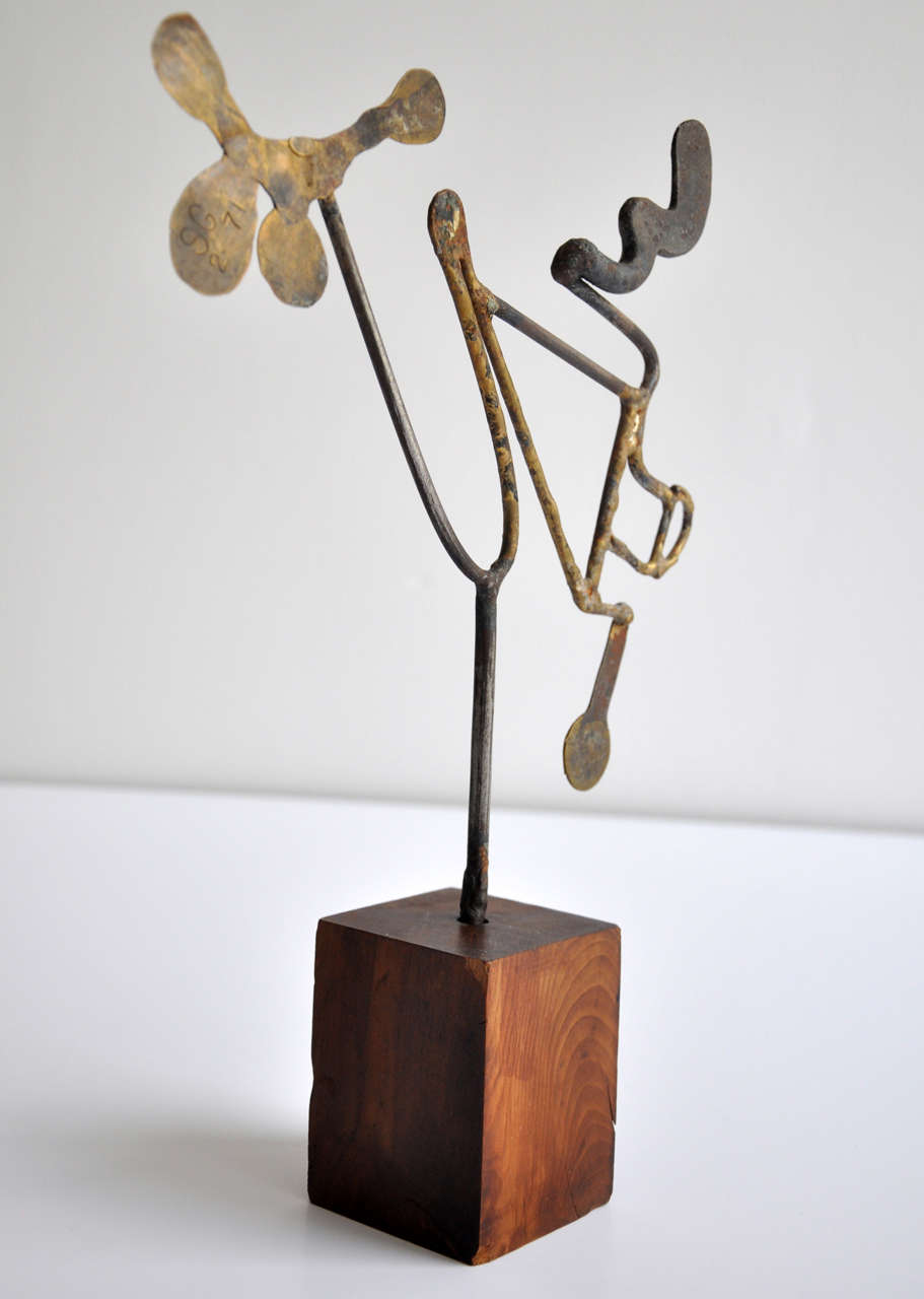 A hammered bronze and iron abstract sculpture by the American artist Sidney Gordon (1918-1996).  Highly regarded for his innovative use of metals, Gordin enjoyed solving the technical problems involved in self-expression.  His work was first shown