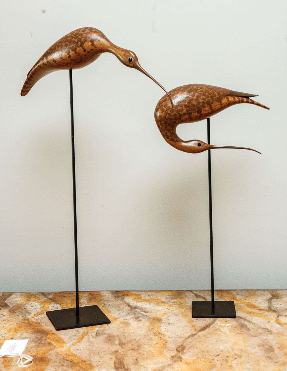 Pair of carved wooden birds.  The measurements are as follows: 
Tall: 17