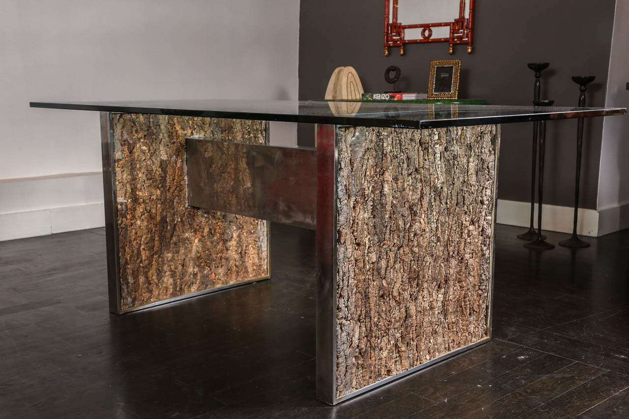This fantastic dining table is truly stunning, heavy chrome base with tree bark panels on both sides of the pedestals hold together by a thick chrome piece.
This table is very much in the style of Gabriella Crespi but it is not signed however this