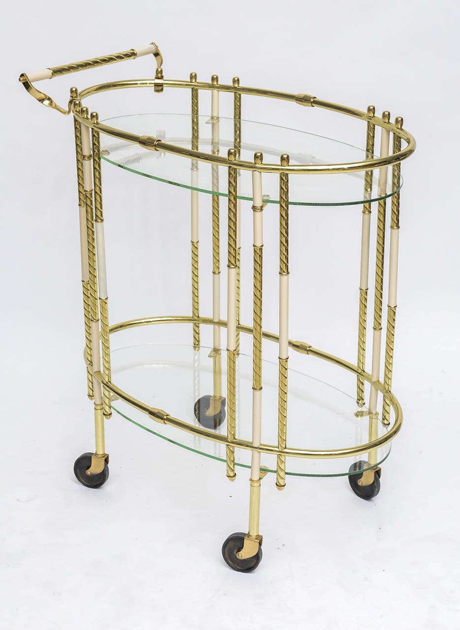 Whimsical Italian spiral-twist brass bar cart punctuated by alternating off-white enamel inserts. Professionally restored.