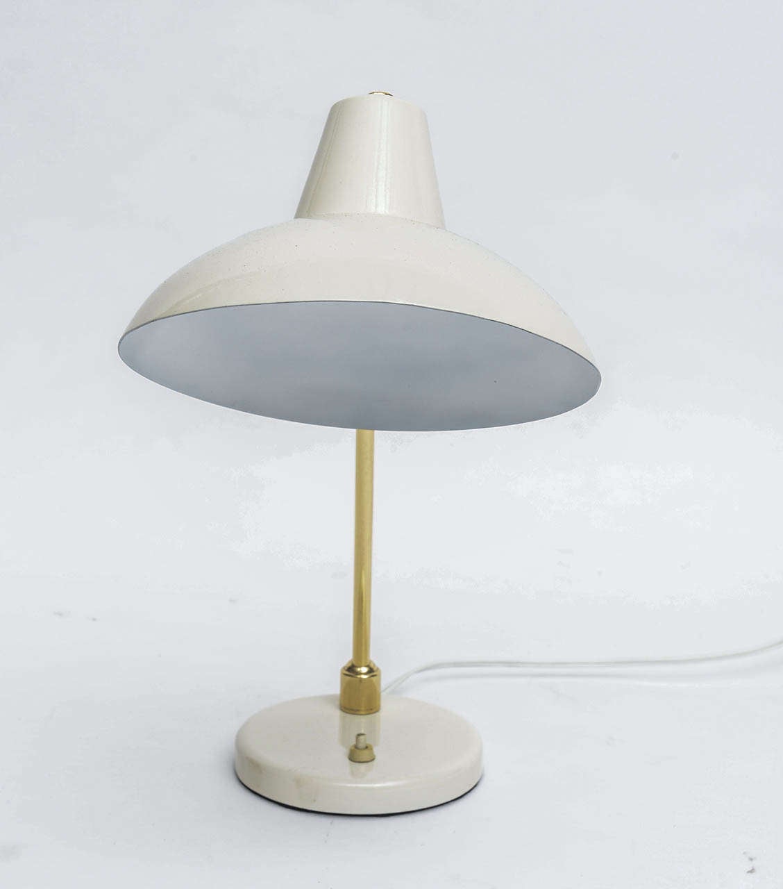 Articulated brass desk lamp with off-white enameled shade. Newly polished and re-wired.