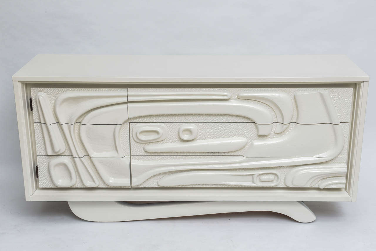 We love the drama (and dare we say fun) of this Witco dresser. A fresh off-white satin finish highlights its sculptural quality.