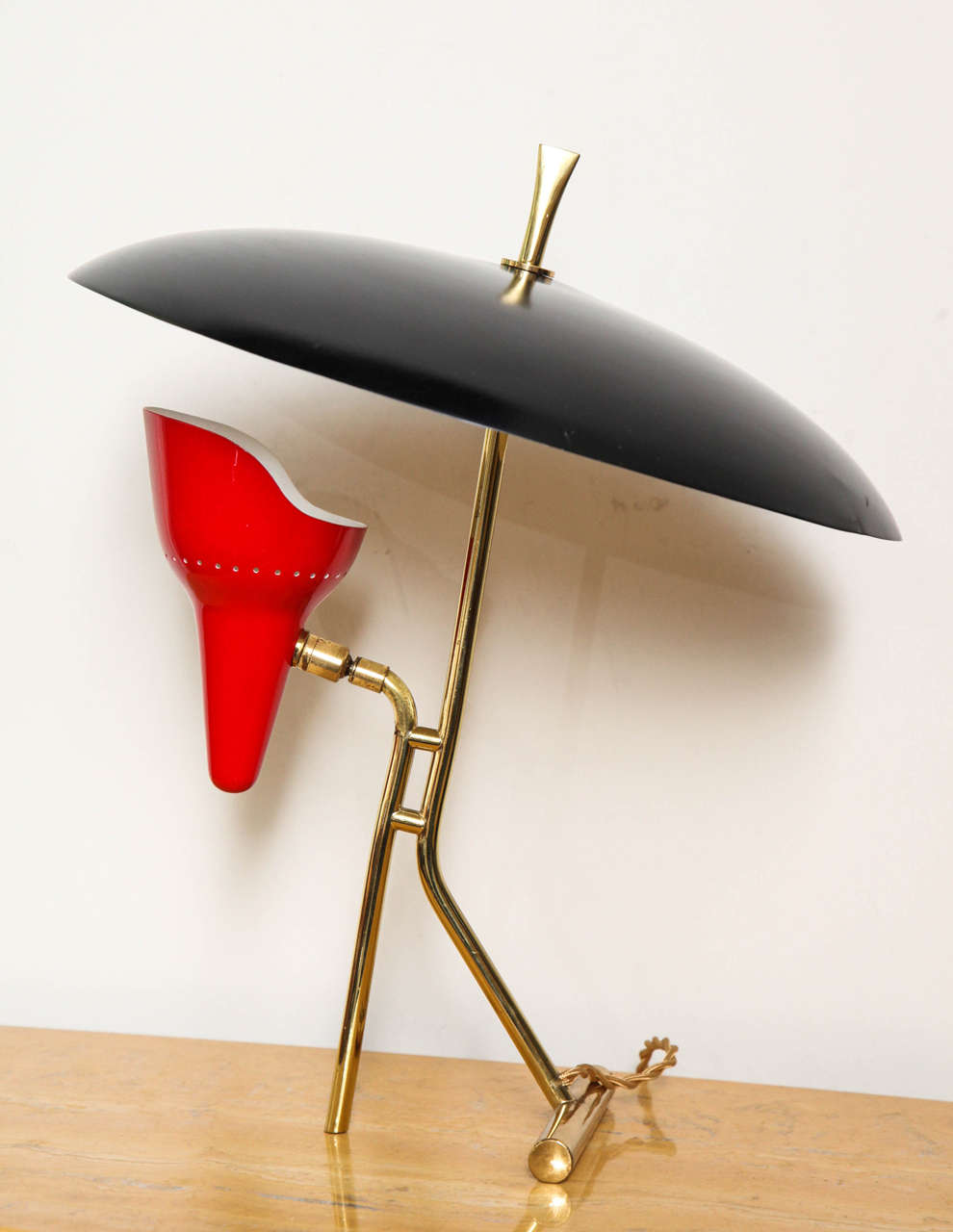 Wonderful desk lamp made in Milan, 1955, small red shade is adjustable as is the black reflector, great quality, rare form.