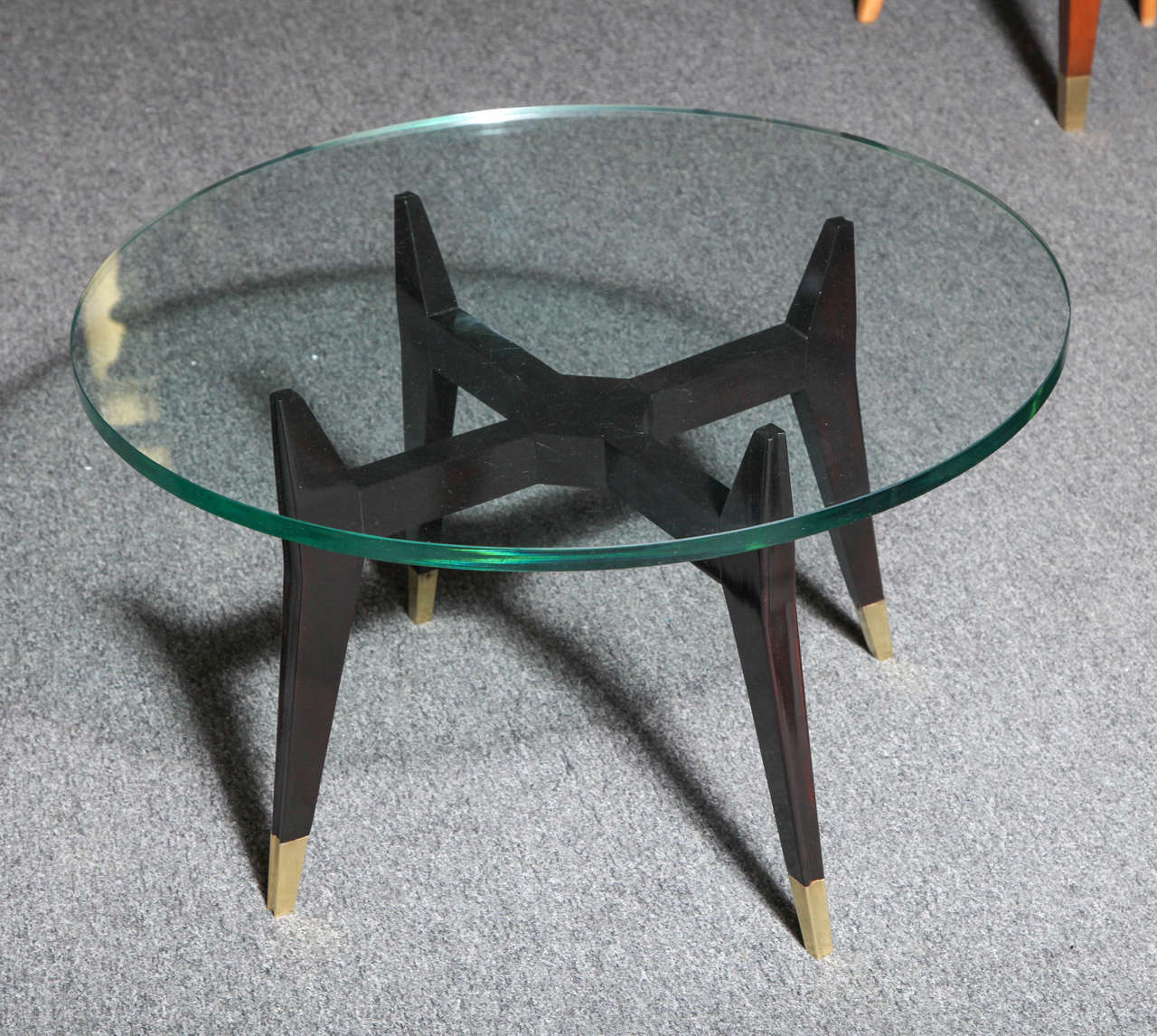 Modernist cocktail table made in Milan 1950 by Dassi et Figli. Base in carved dark walnut with brass sabots, beautifully detailed on legs, I have two each pieces separately.
 