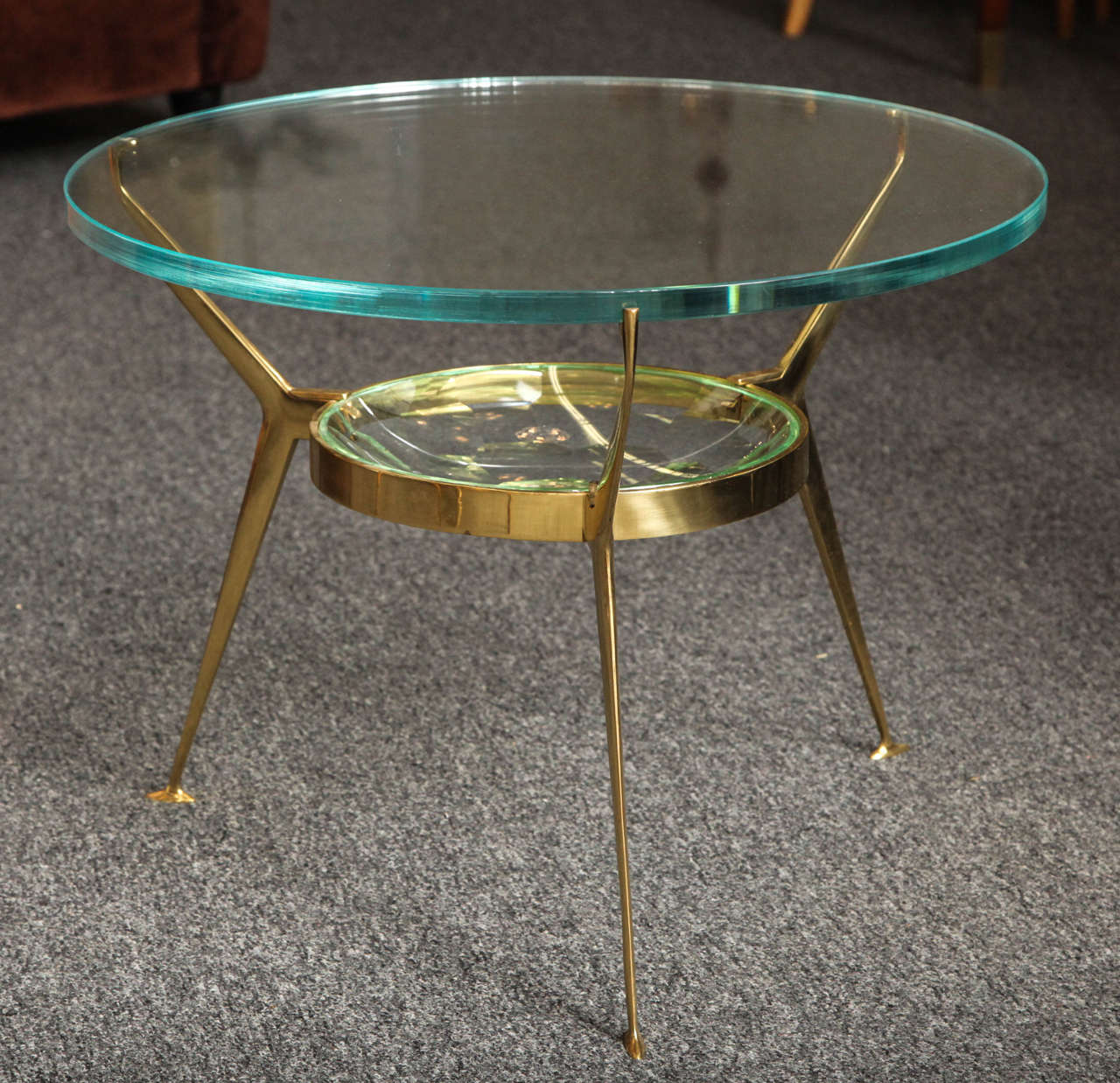 Stunning cocktail table made in Milan 1955 by Fontana Arte, brass base with a large cut-glass lens fixed into the frame, unusual to see with the cut glass in this large size, most likely a commission real beauty, great quality.