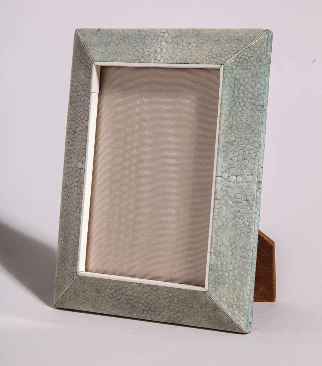 Green shagreen frame with felt-covered back and stand