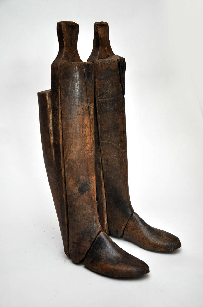 19th century all wood Italian boots molds. Truly handsome pair of boot molds are constructed of wood and leather.
Found in the South of France.

Dimensions: 10