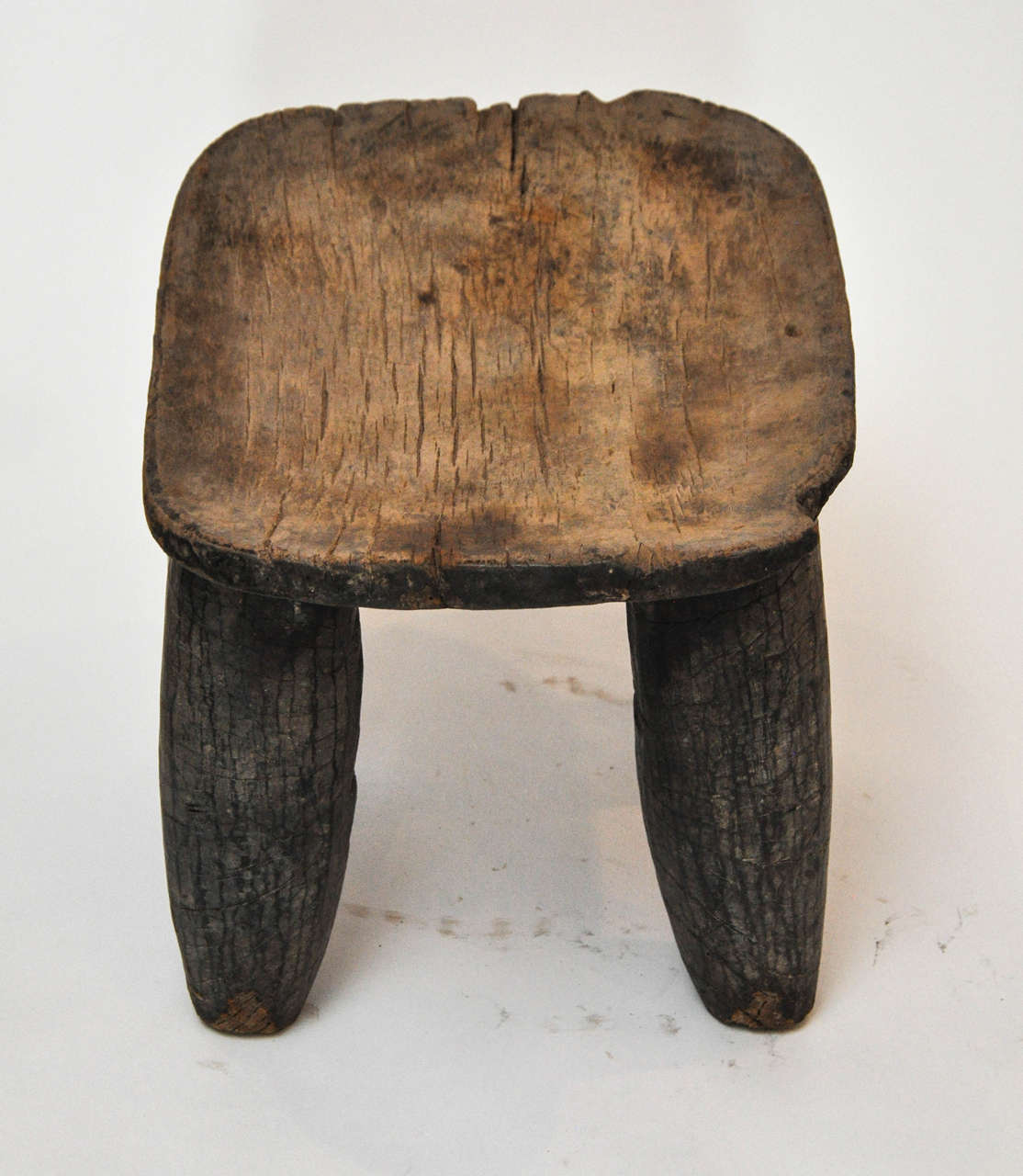 Beautifully worn stool with charm. Legs are done with a gorgeous Rustic Feel. Senufo spans from Mali to Katiola in Cote d'Ivoire.