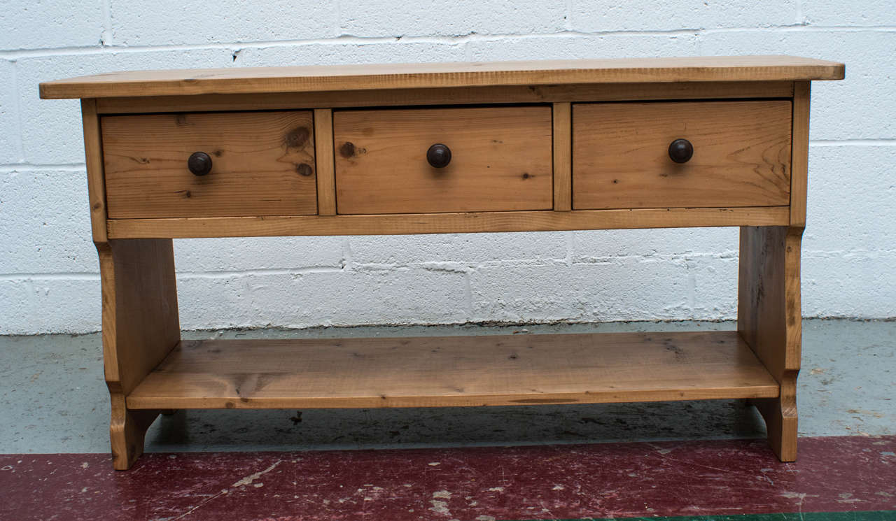 A pretty vintage water bench with three dovetailed drawers and iron knobs.