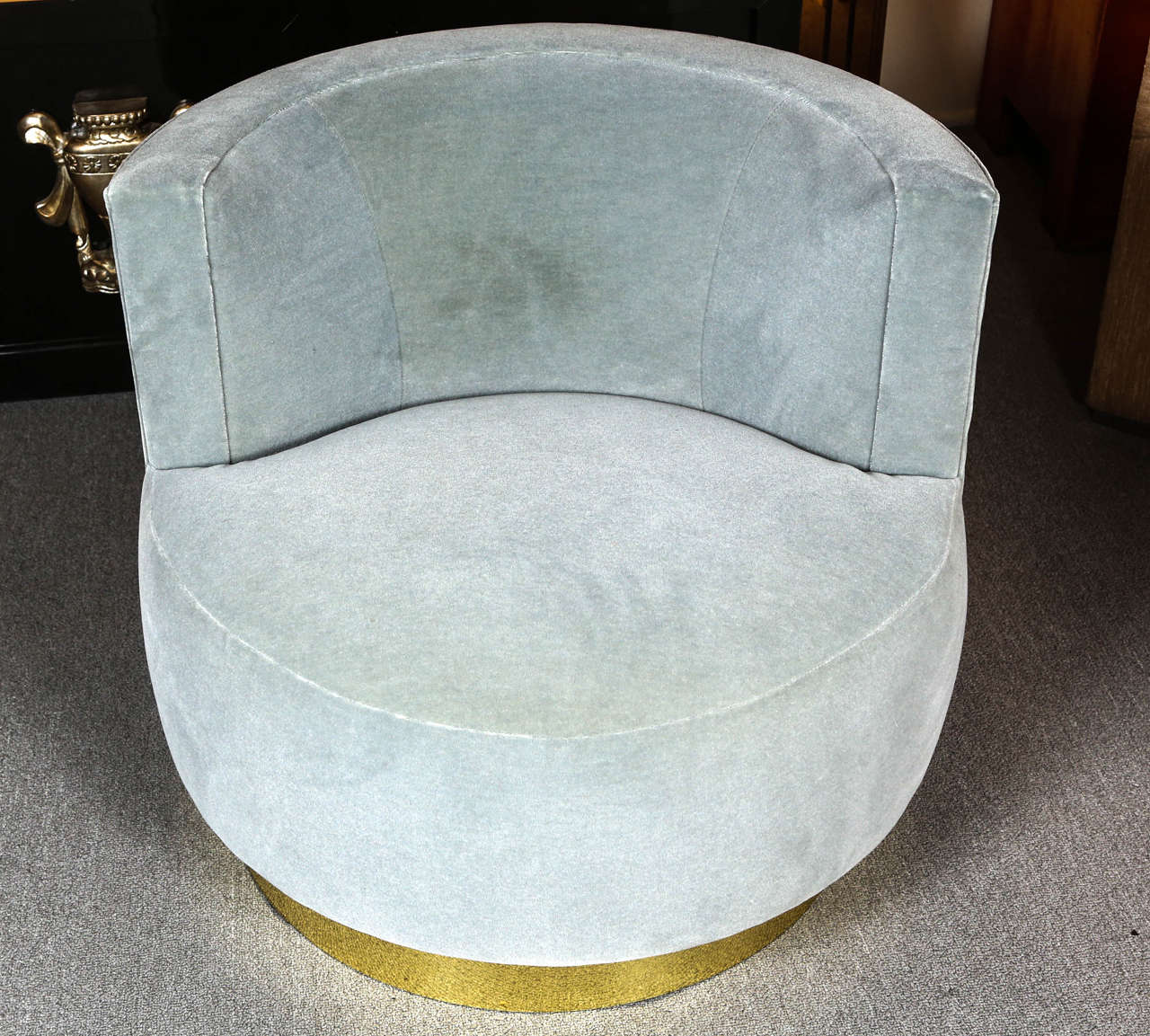 Pair of elegant swivel chairs designed by Steve Chase.
The chairs have been beautifully reupholstered in luxurious mohair fabric, and
have polished brass bands.